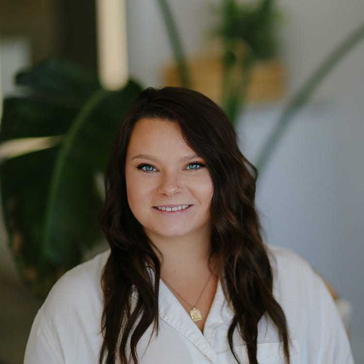 Portrait of Mallory Hodge, a professional stylist at Alana Kai Salon, showcasing their expertise and style.