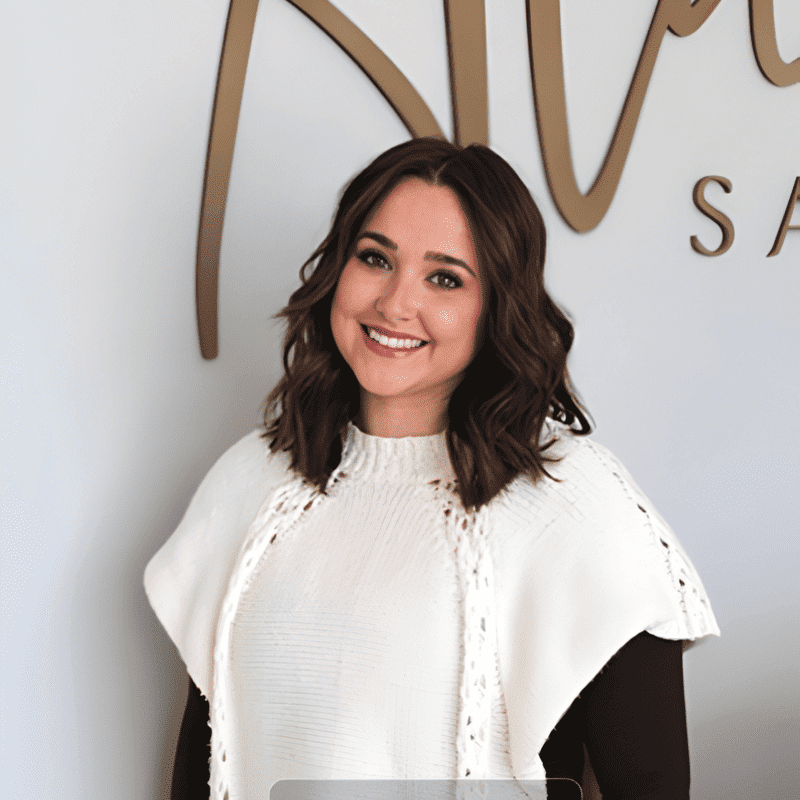Portrait of Saylor Gray, a professional stylist at Alana Kai Salon, showcasing their expertise and style.