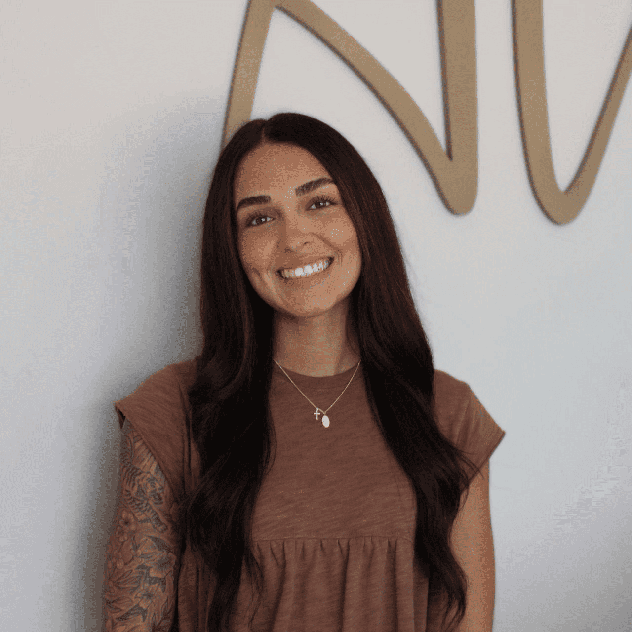 Portrait of Kayla, a professional stylist at Alana Kai Salon, showcasing their expertise and style.
