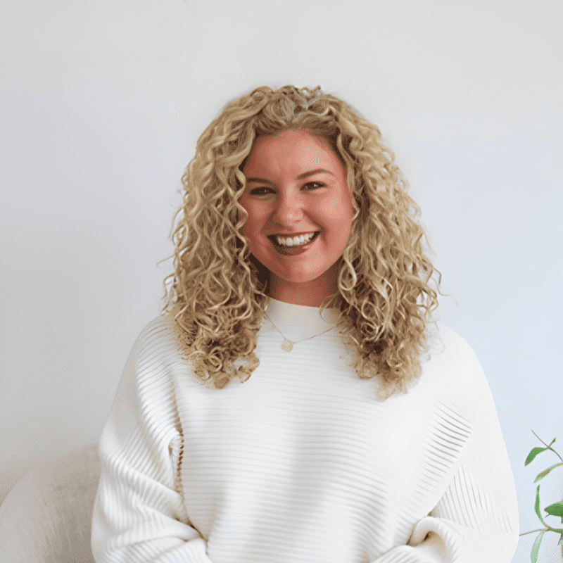 Portrait of Amber Rinehart, a professional stylist at Alana Kai Salon, showcasing their expertise and style.